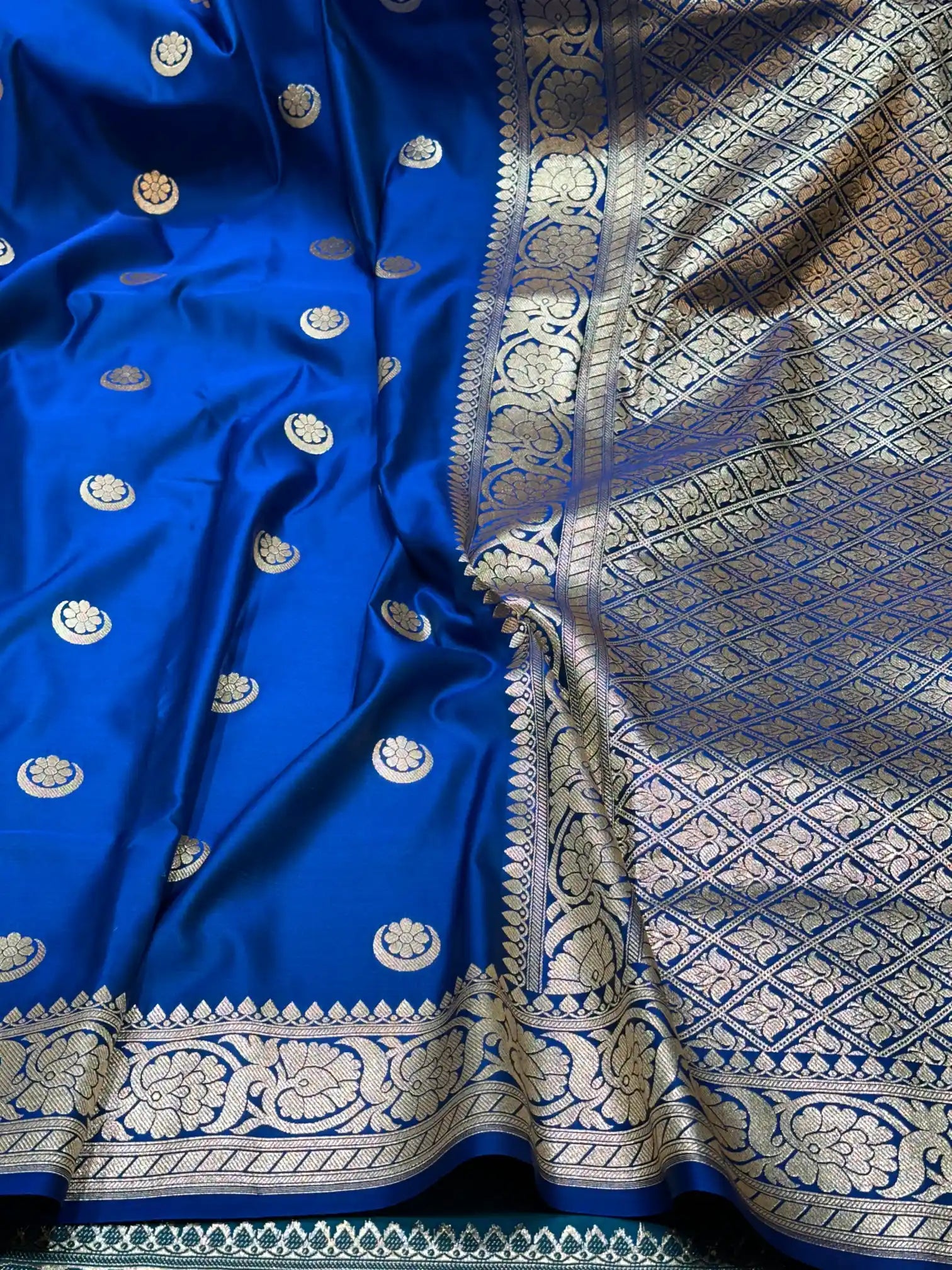 Mesmerising Emerald Blue Satin Katan Silk Banarasi Saree with Heritage Origin Chand Tara Design in Body along with Floral Intricate Borders
