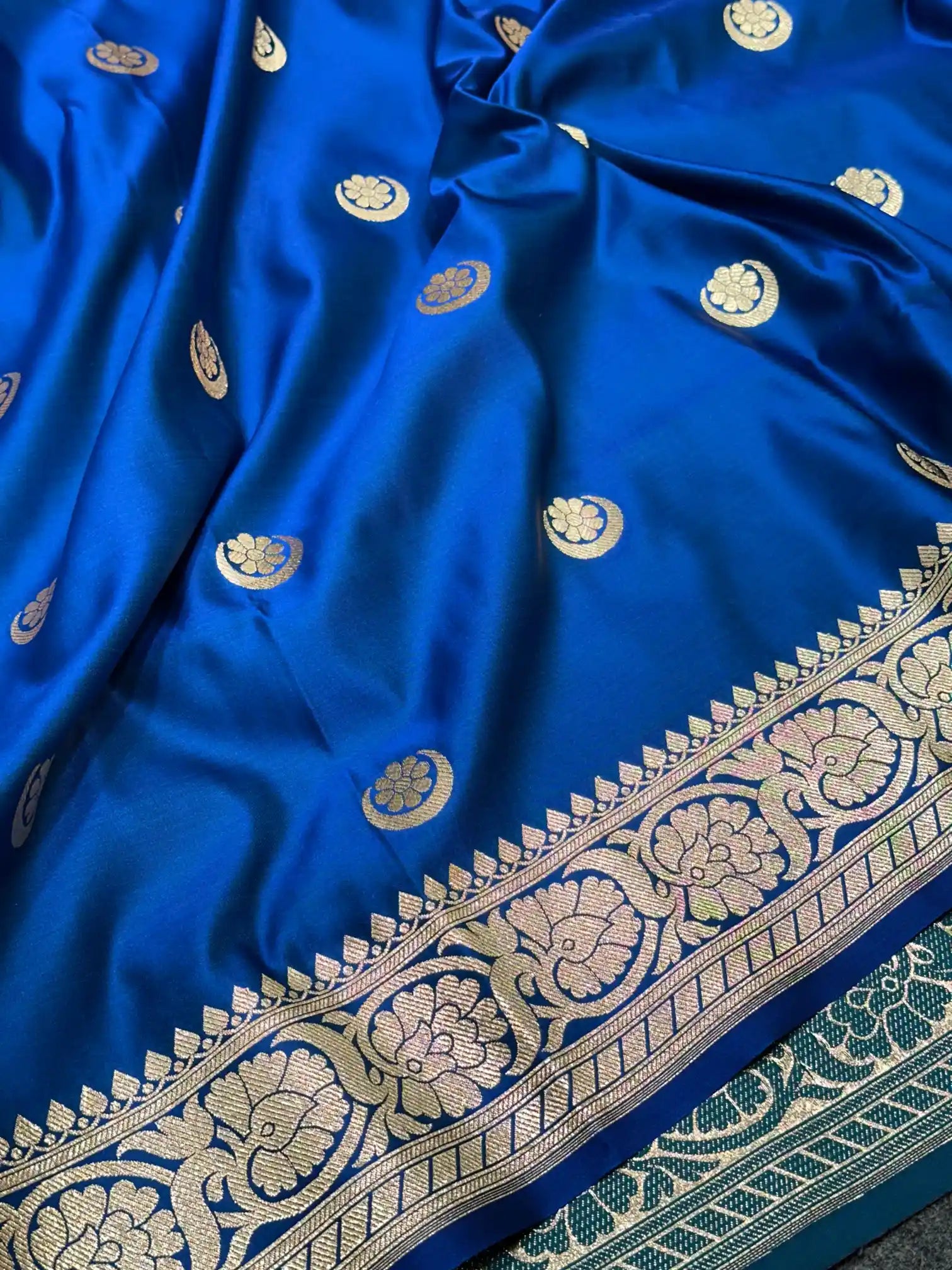 Mesmerising Emerald Blue Satin Katan Silk Banarasi Saree with Heritage Origin Chand Tara Design in Body along with Floral Intricate Borders