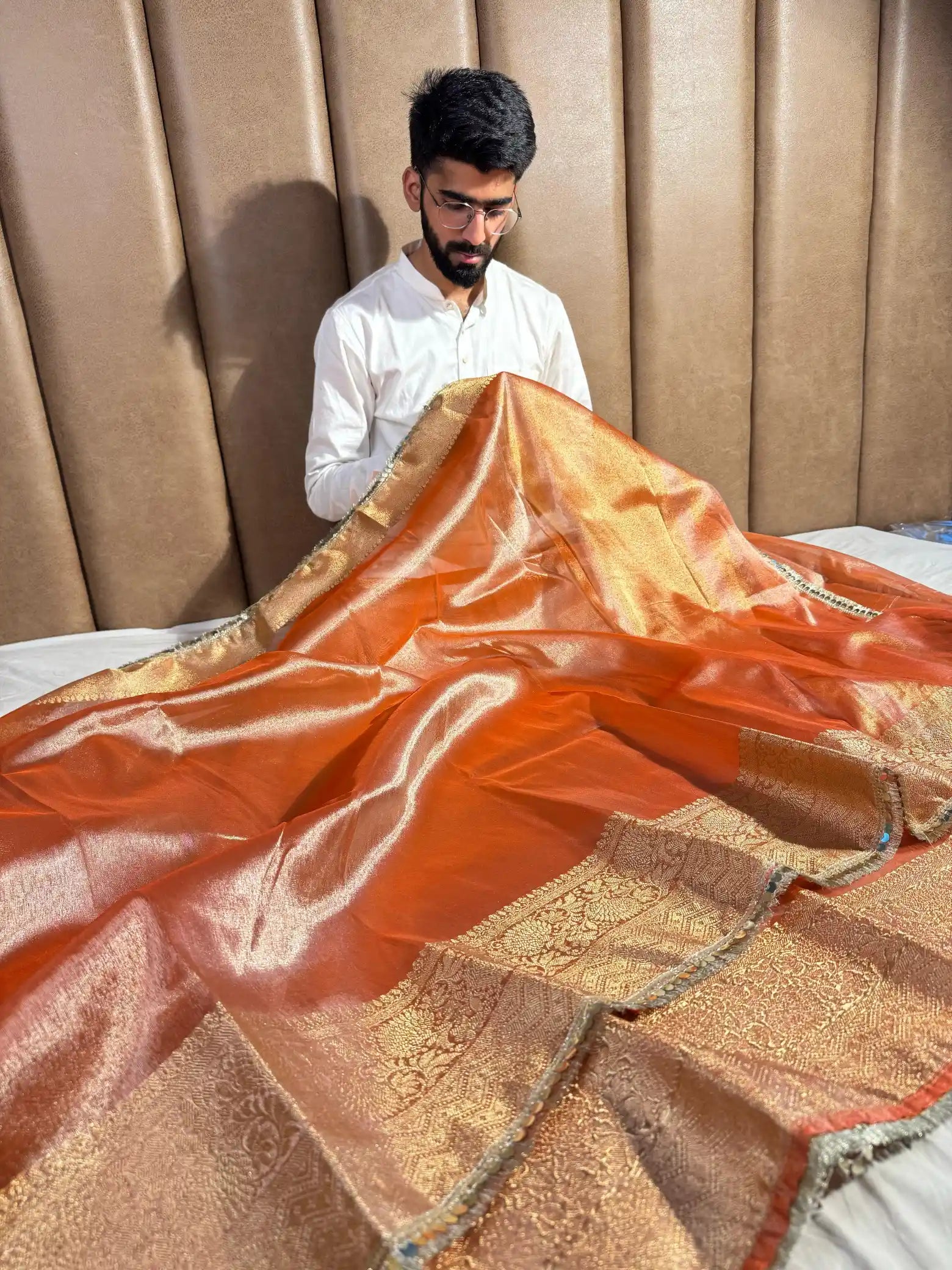 Metallic Orange Glass Tissue Silk Banarasi Saree with Intricate Floral Borders and Pretty Lace Work