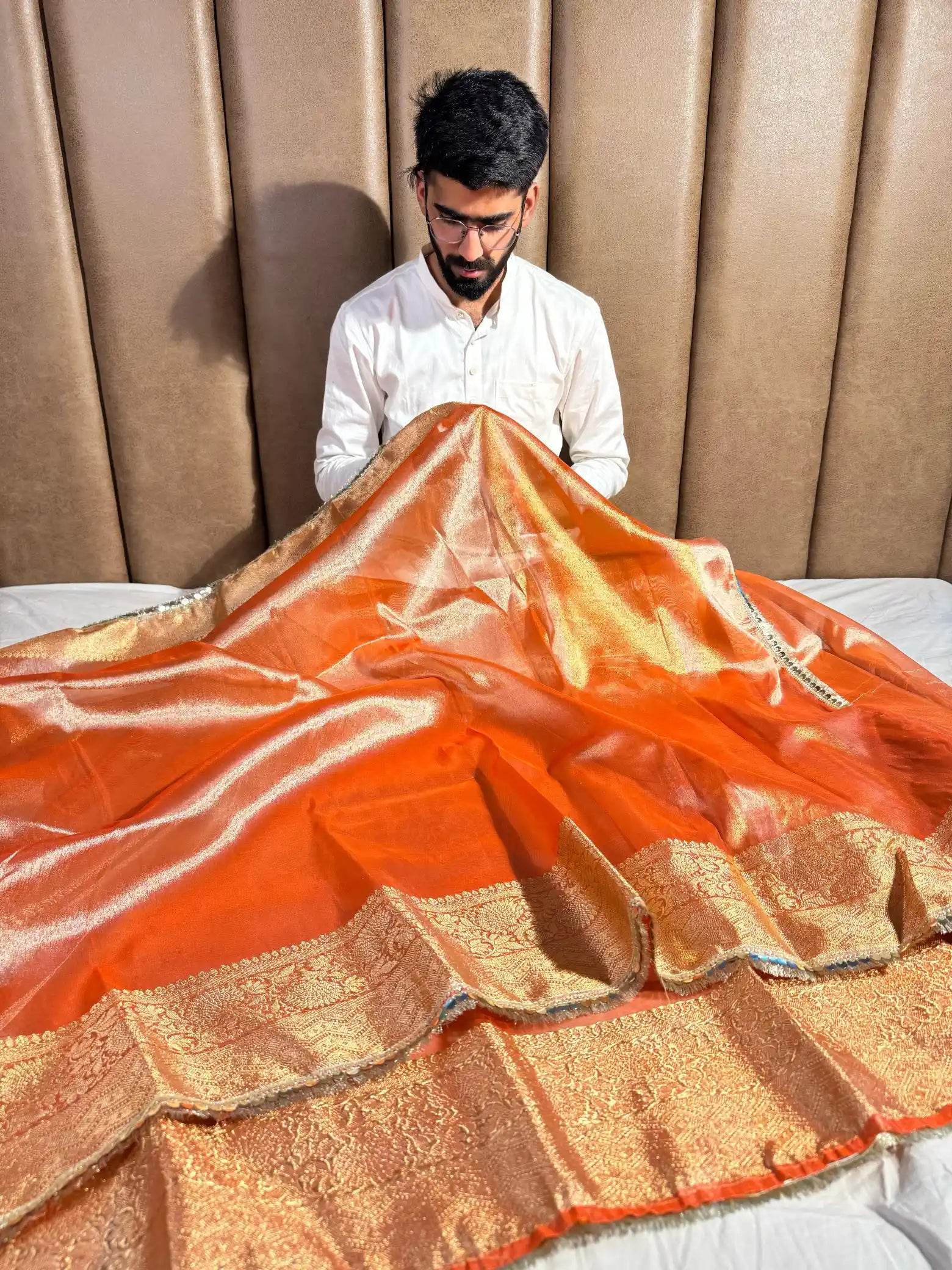 Metallic Orange Glass Tissue Silk Banarasi Saree with Intricate Floral Borders and Pretty Lace Work