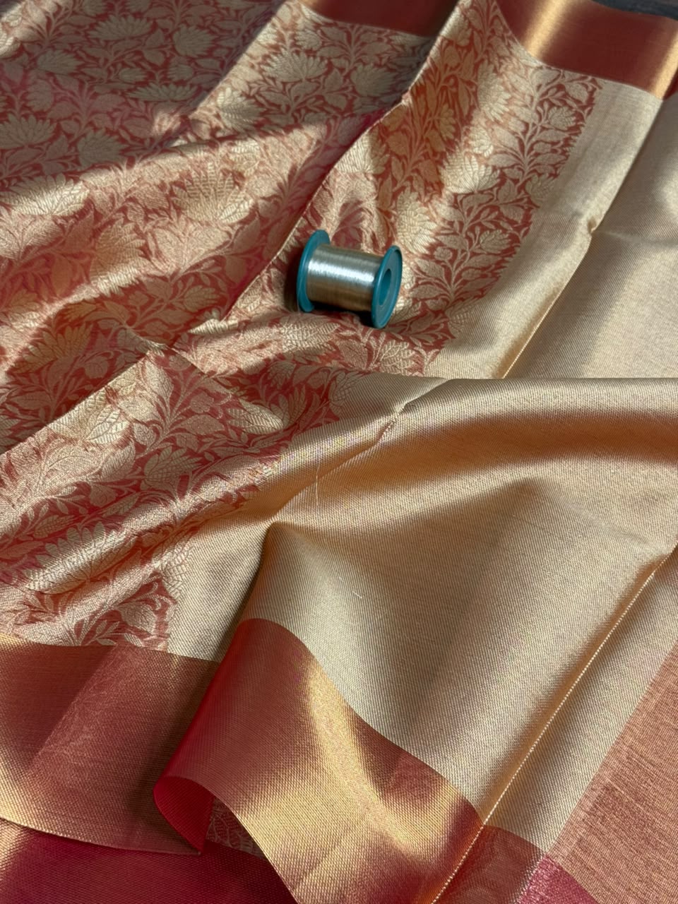 Dull red embossed Softsilk saree