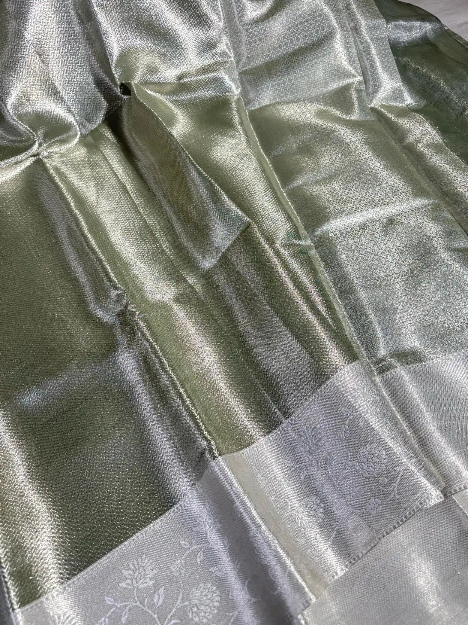 Sea Green Embossed Soft Tissue Silk Saree