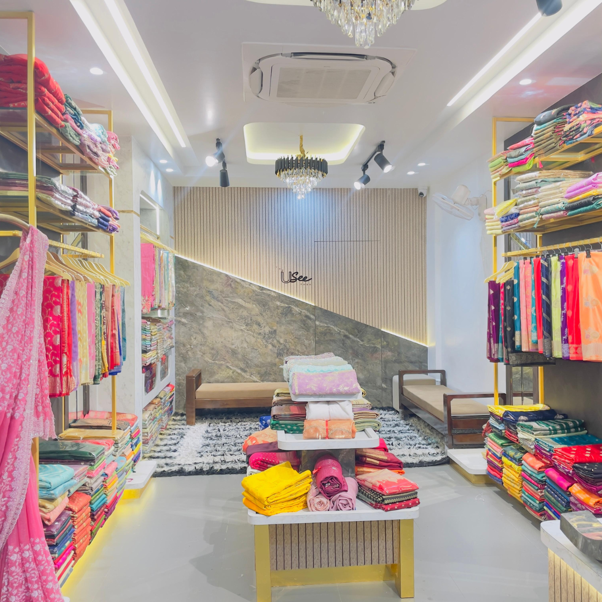 Colorful fabric store interior with shelves and display tables.