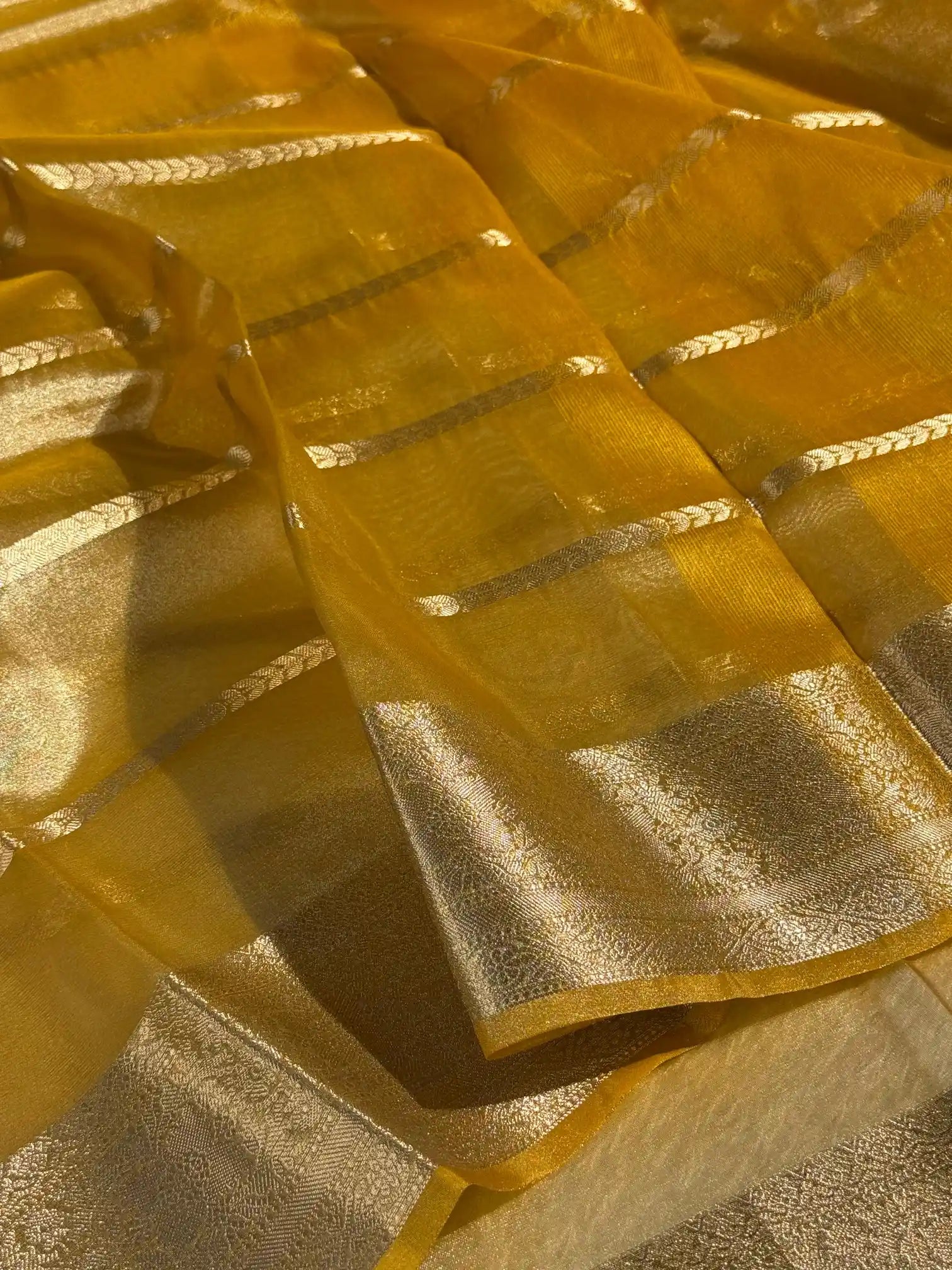 Metallic yellow soft tissue silk traditional saree