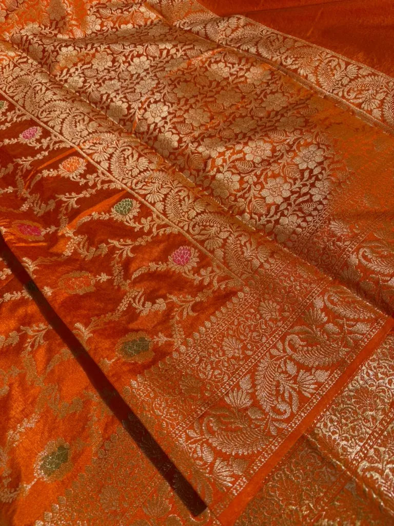 Bright orange floral Meenakari warm silk Banarasi saree