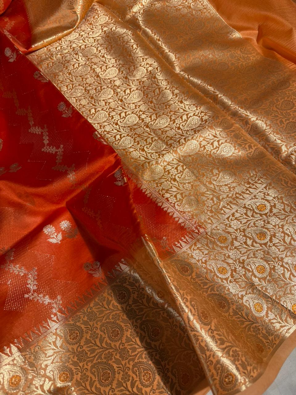 Bright orange intricate weave raw dupion silk saree