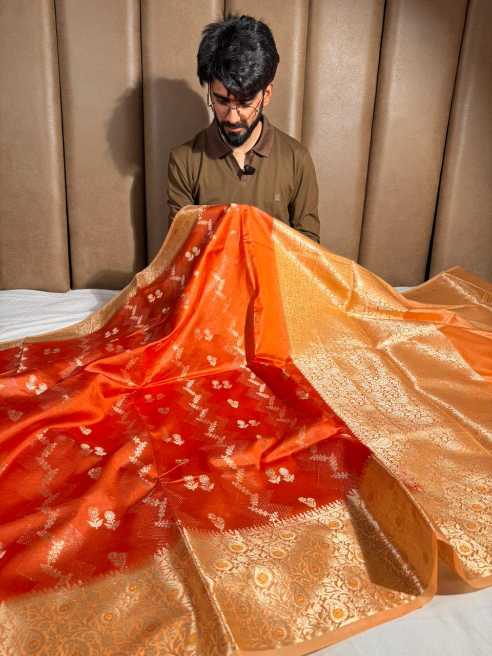 Bright orange intricate weave raw dupion silk saree