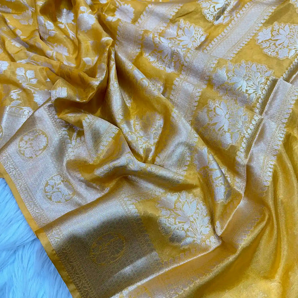 
Fanta Orange Floral Chinia Silk Banarasi Saree
