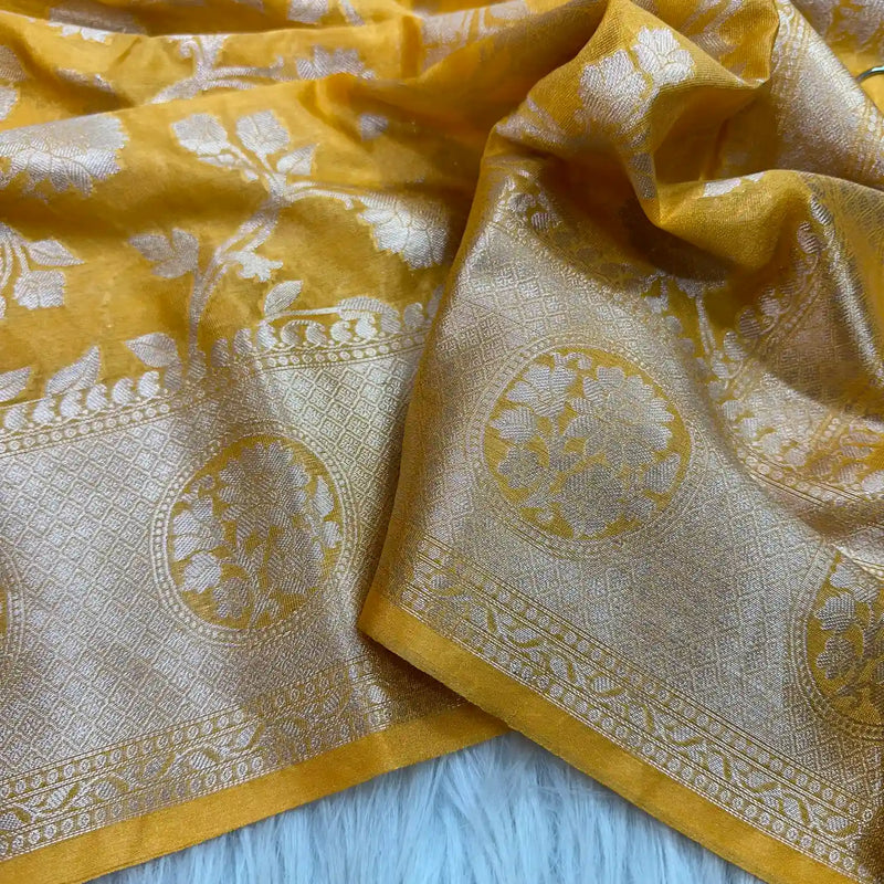 
Fanta Orange Floral Chinia Silk Banarasi Saree
