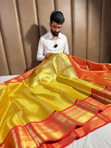 Golden Shimmery Glare in Embossed Soft Tissue Silk Saree