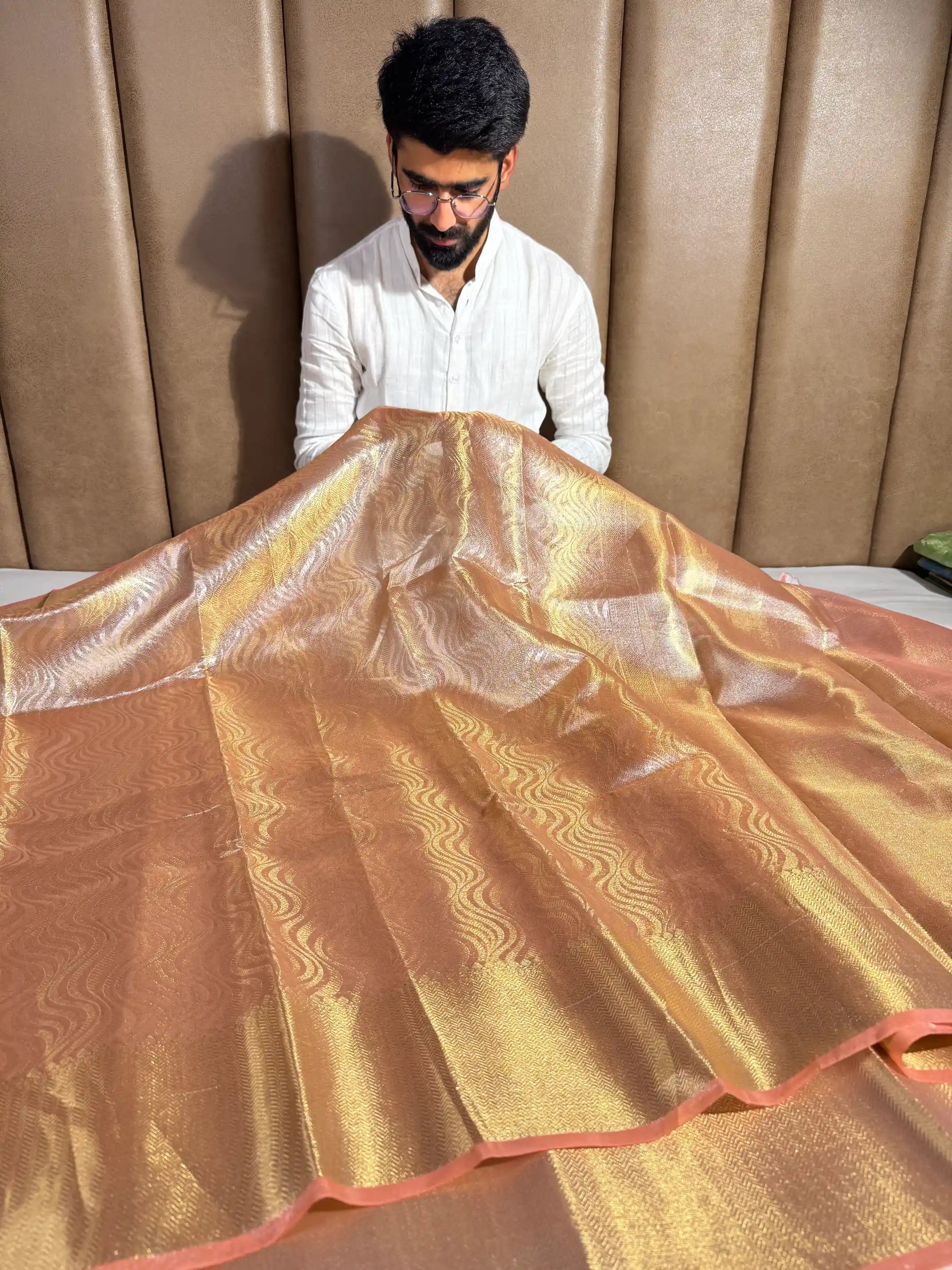 Light peach embossed tissue silk saree