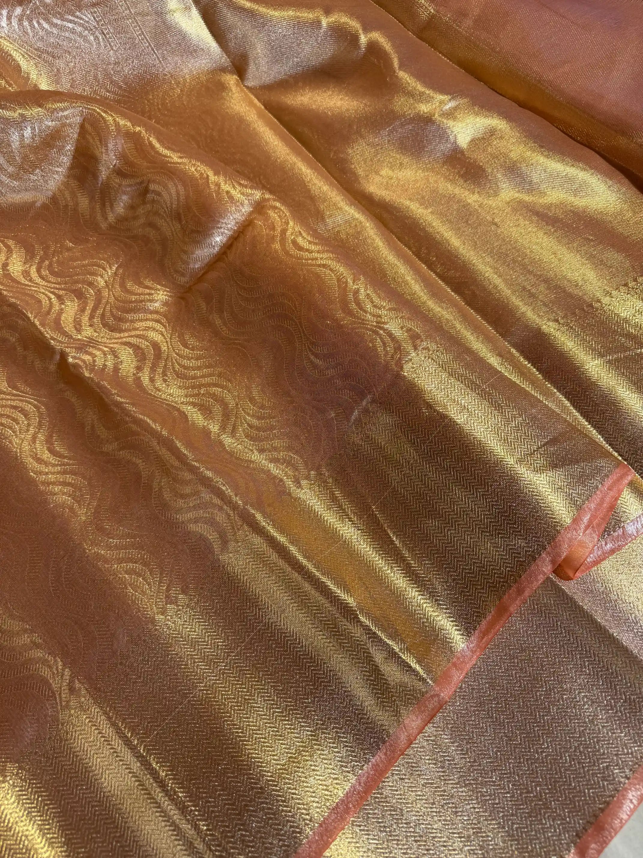 Light peach embossed tissue silk saree