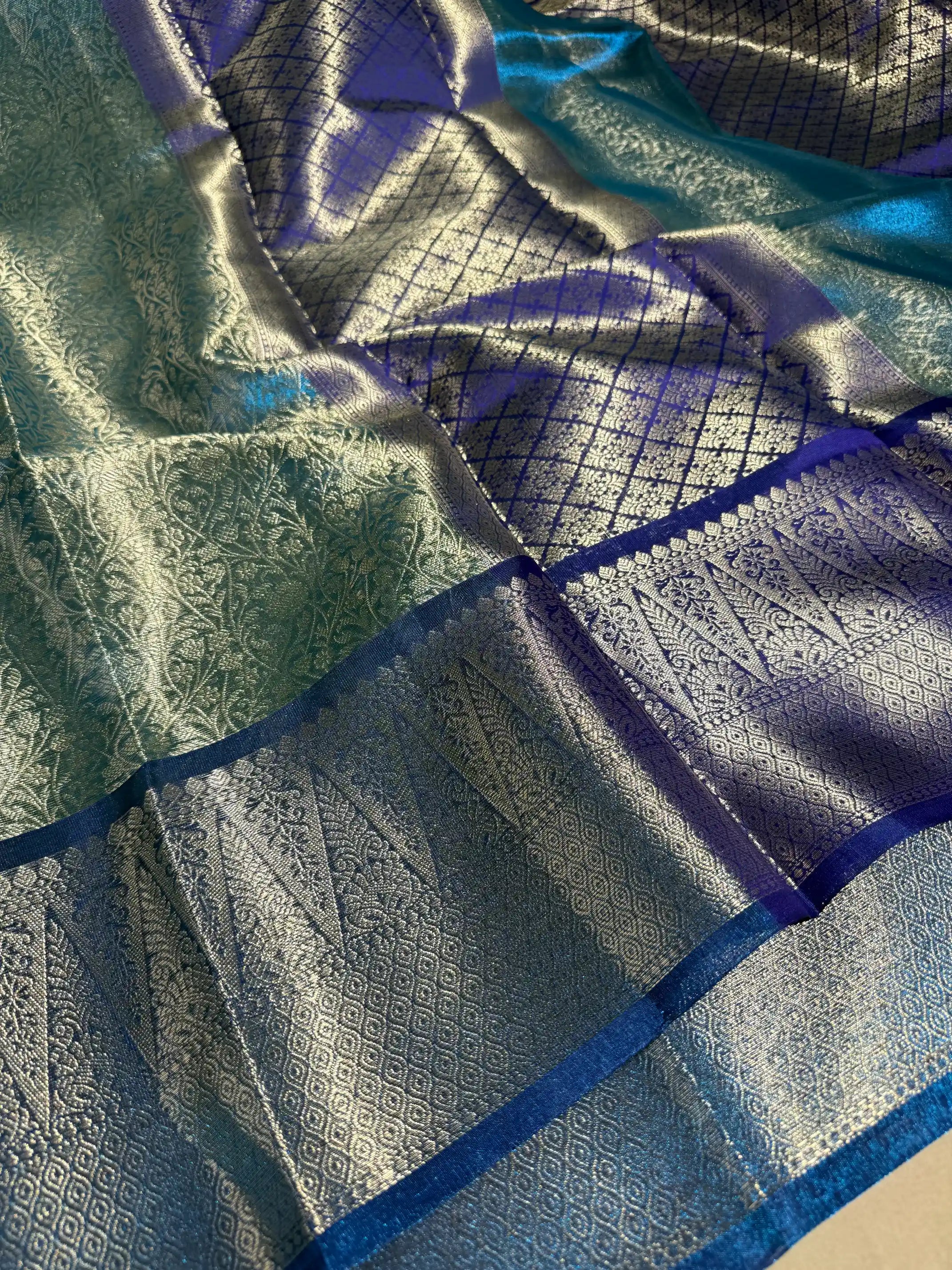 Metallic Firozi Blue Tissue Silk Kanjivaram Embossed Banarasi Saree