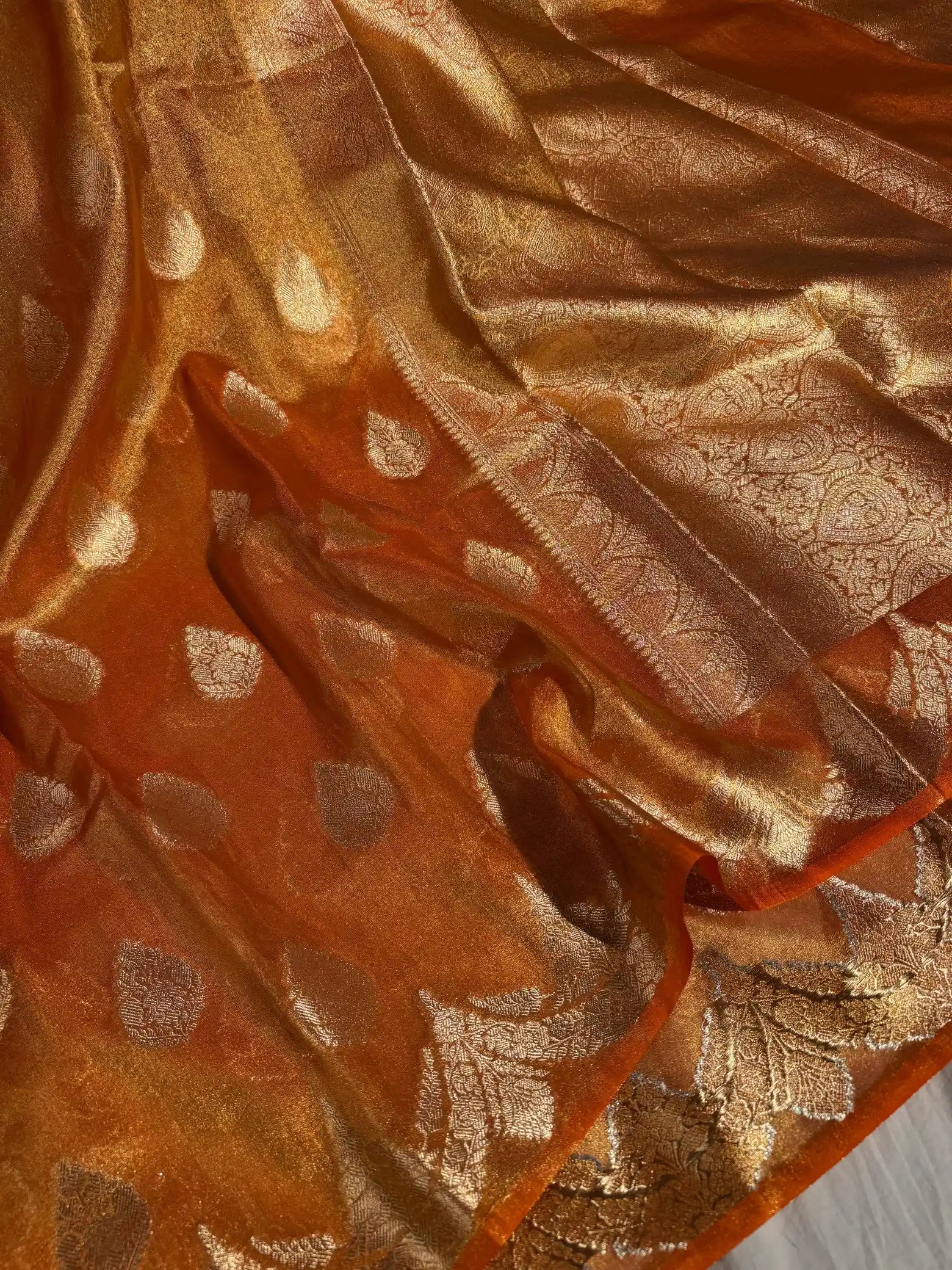 Orange Tissue banarasi saree with rich pallu and blouse