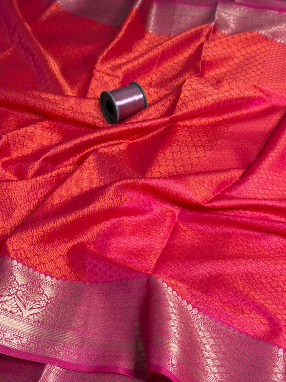Dark orange Kora muslin embossed Banarasi Saree